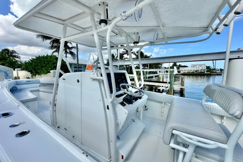  Yacht Photos Pics 2006 Jupiter 31FS boat interior with helm, seating, and waterfront view.