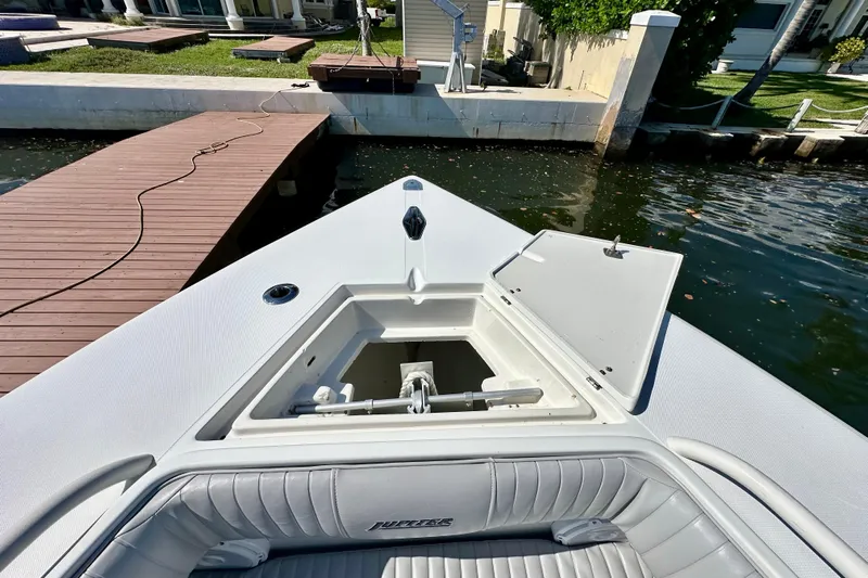  Yacht Photos Pics Bow of 2006 Jupiter 31FS boat with open hatch near dock.