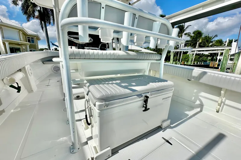  Yacht Photos Pics 2006 Jupiter 31FS boat interior with seating and storage under sunny skies.