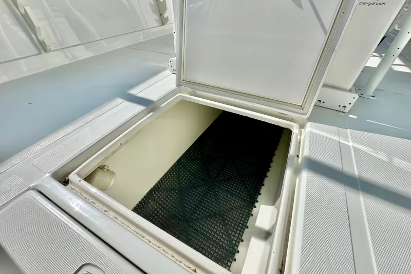  Yacht Photos Pics Open storage compartment on 2006 Jupiter 31FS boat deck.