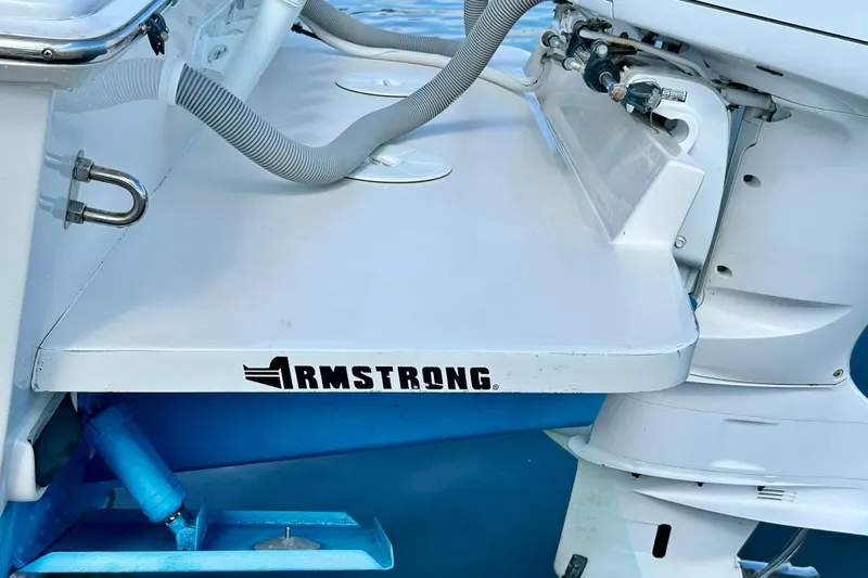  Yacht Photos Pics 2006 Jupiter 31FS boat with Armstrong bracket and outboard motor.