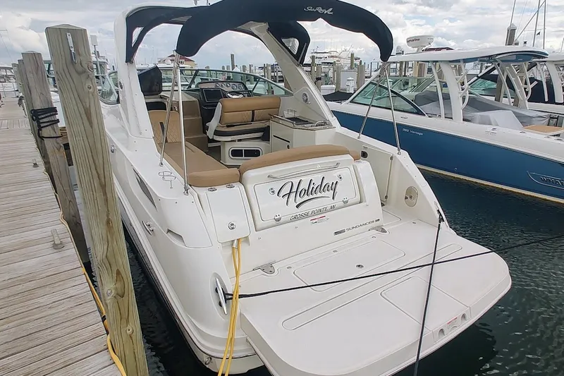  Yacht Photos Pics 2017 Sea Ray Sundancer 310 docked at marina, featuring spacious seating and sleek design.