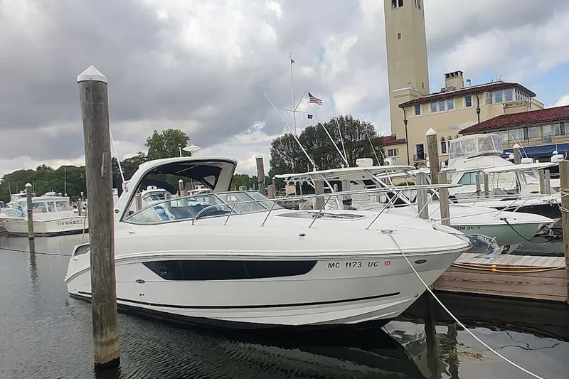  Yacht Photos Pics 2017 Sea Ray Sundancer 310 docked at marina under cloudy sky.