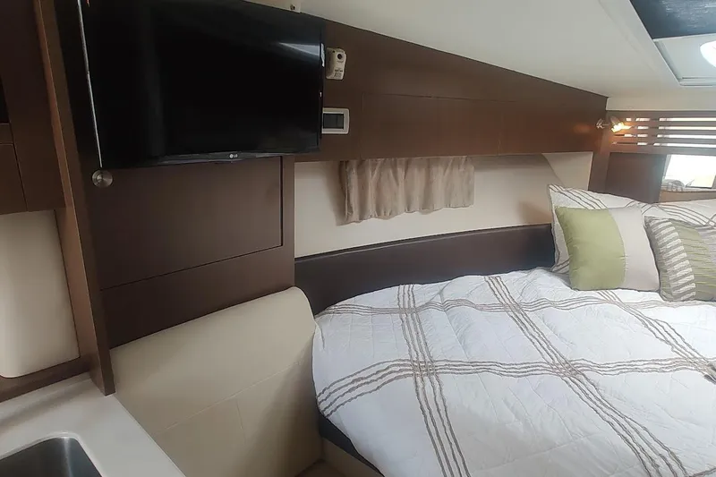  Yacht Photos Pics 2017 Sea Ray Sundancer 310 cabin interior with bed, TV, and modern decor.