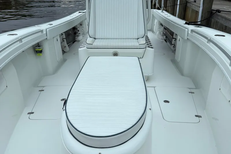Salty Dog 2 Yacht Photos Pics 2013 Yellowfin 32 boat interior with white cushioned seating and spacious deck.