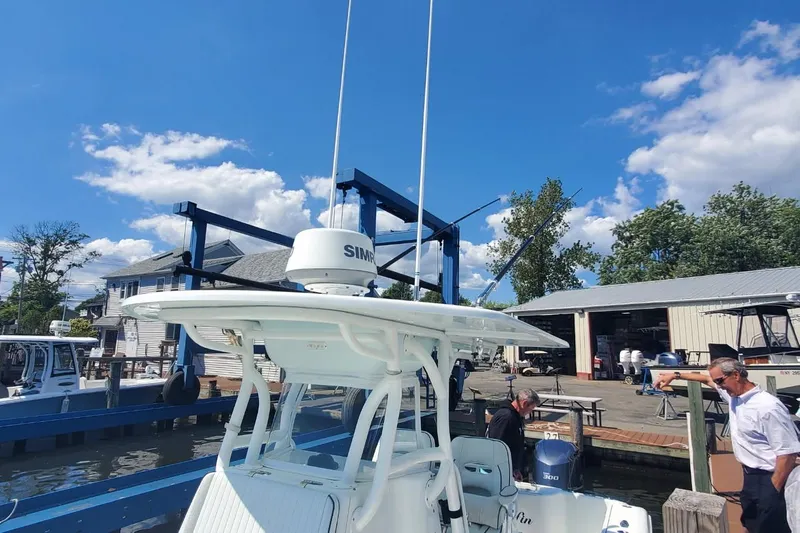 Salty Dog 2 Yacht Photos Pics 2013 Yellowfin 32 boat docked at marina with clear blue sky background.