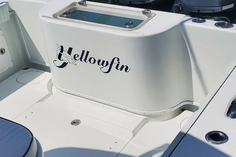 Salty Dog 2 Yacht Photos Pics 2013 Yellowfin 32 boat interior with logo and storage compartment.