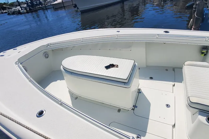 Salty Dog 2 Yacht Photos Pics 2013 Yellowfin 32 boat interior with seating and storage, docked by the water.