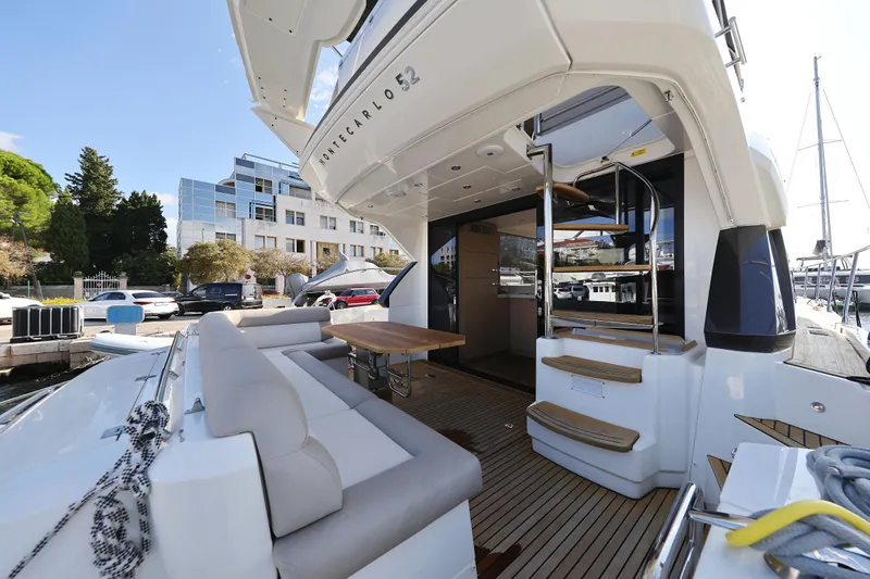 Neo Yacht Photos Pics 2022 Beneteau Monte Carlo 52 yacht with elegant deck and seating area.