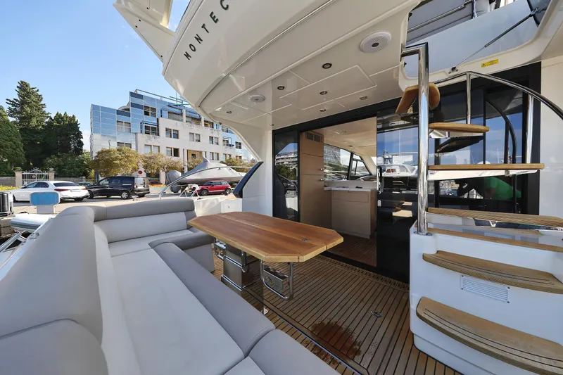 Neo Yacht Photos Pics Luxurious 2022 Beneteau Monte Carlo 52 yacht with elegant outdoor seating and modern interior.