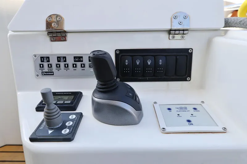 Neo Yacht Photos Pics Control panel of 2022 Beneteau Monte Carlo 52 yacht with joysticks and switches.