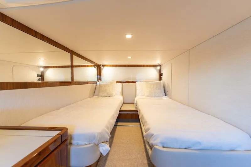 Ventures64 Yacht Photos Pics Interior of 2022 Riviera 4800 Sport Yacht with twin beds and modern design.