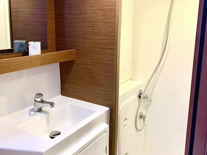  Yacht Photos Pics Modern bathroom in 2024 Lagoon 42 yacht with sink and shower.