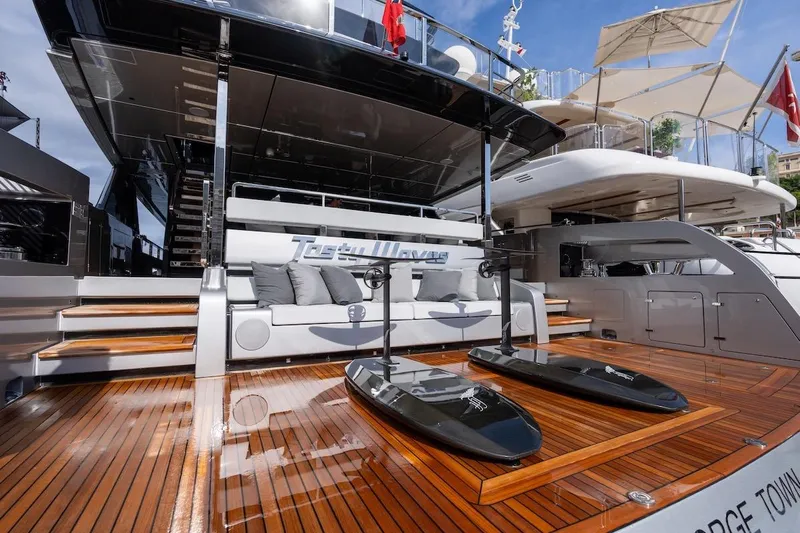 Tasty Waves Yacht Photos Pics Luxury 2025 Riva 130' Bellissima yacht with sleek deck and modern design.