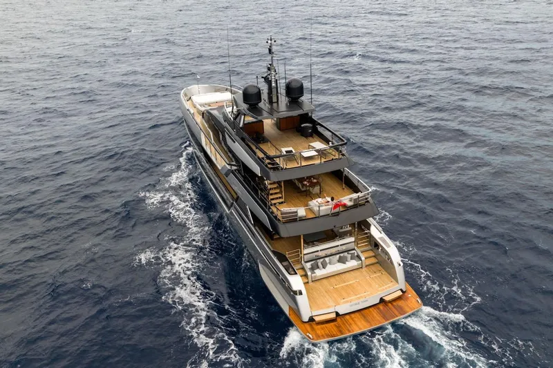 Tasty Waves Yacht Photos Pics Luxury yacht Riva 130' Bellissima 2025 cruising on open sea, aerial view.