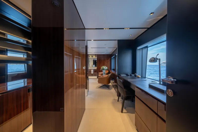 Tasty Waves Yacht Photos Pics Luxurious interior of 2025 Riva 130' Bellissima yacht with elegant furnishings and ocean view.