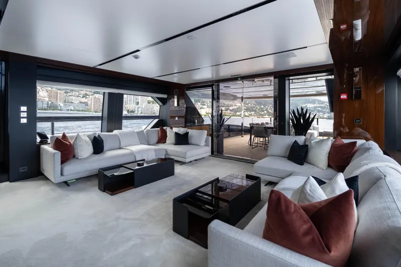 Tasty Waves Yacht Photos Pics Luxurious interior of 2025 Riva 130' Bellissima yacht with elegant seating and scenic views.
