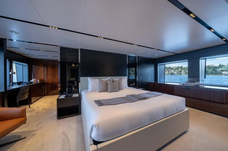 Tasty Waves Yacht Photos Pics Luxurious bedroom interior on 2025 Riva 130' Bellissima yacht with waterfront views.