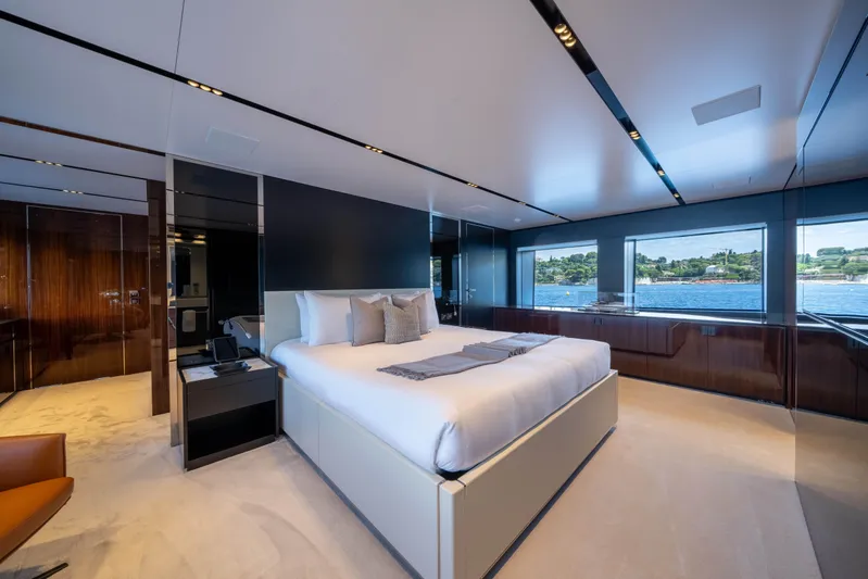 Tasty Waves Yacht Photos Pics Luxurious bedroom interior on 2025 Riva 130' Bellissima yacht with ocean view.