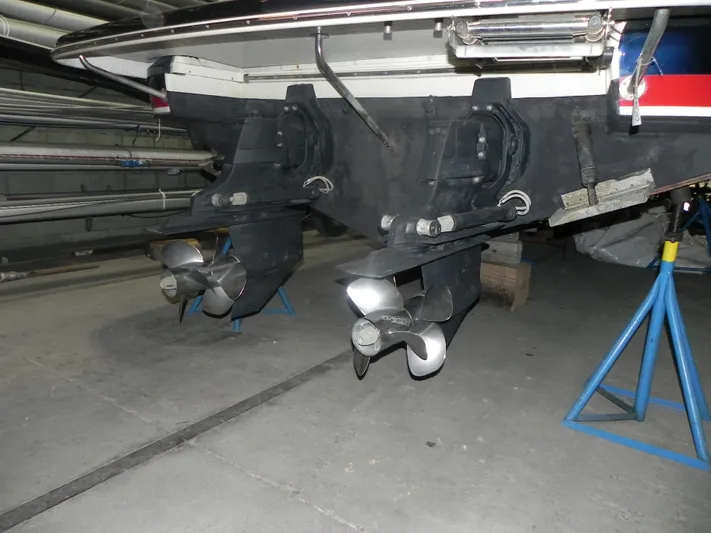 Yours To Name Yacht Photos Pics 2015 Chris-Craft 28 Heritage Corsair boat propellers in storage on stands.