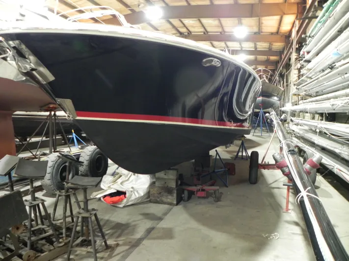 Yours To Name Yacht Photos Pics 2015 Chris-Craft 28 Heritage Corsair in storage, showcasing sleek design and craftsmanship.