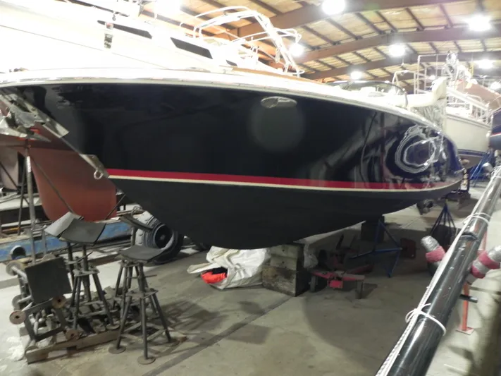 Yours To Name Yacht Photos Pics 2015 Chris-Craft 28 Heritage Corsair boat in a storage facility.