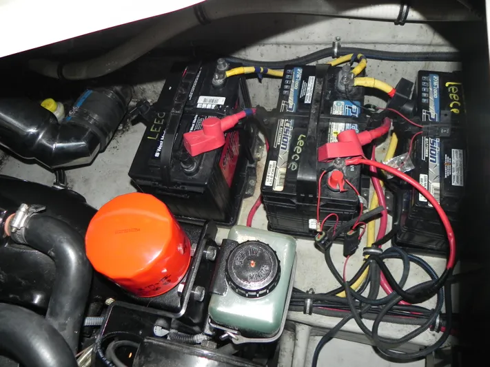 Yours To Name Yacht Photos Pics Battery compartment of 2015 Chris-Craft 28 Heritage Corsair with wiring and components.