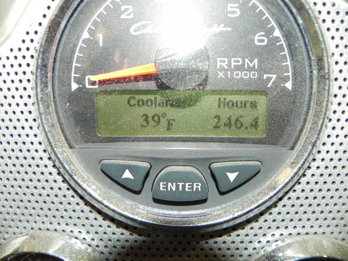 Yours To Name Yacht Photos Pics Close-up of a 2015 Chris-Craft 28 Heritage Corsair RPM gauge displaying coolant temperature and engine hours.
