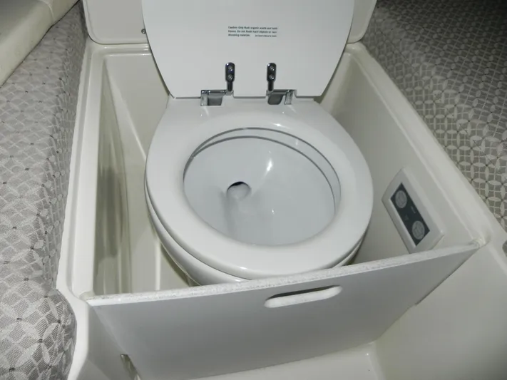 Yours To Name Yacht Photos Pics 2015 Chris-Craft 28 Heritage Corsair boat toilet, compact and functional marine bathroom feature.