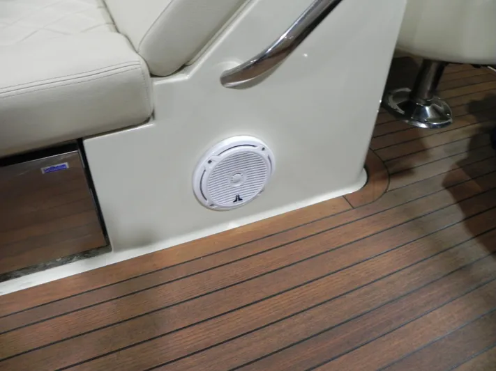 Yours To Name Yacht Photos Pics 2015 Chris-Craft 28 Heritage Corsair interior with speaker and wooden flooring.