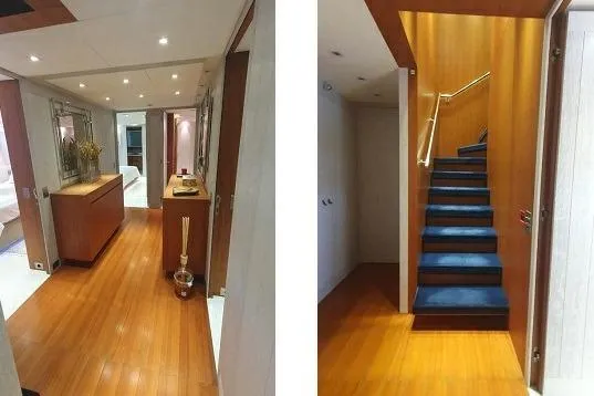 Lucky Me Yacht Photos Pics Luxurious interior of 2010 Baglietto 41 yacht featuring elegant hallway and staircase.