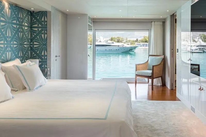 Lucky Me Yacht Photos Pics Luxurious bedroom on 2010 Baglietto 41 yacht with waterfront view and elegant decor.