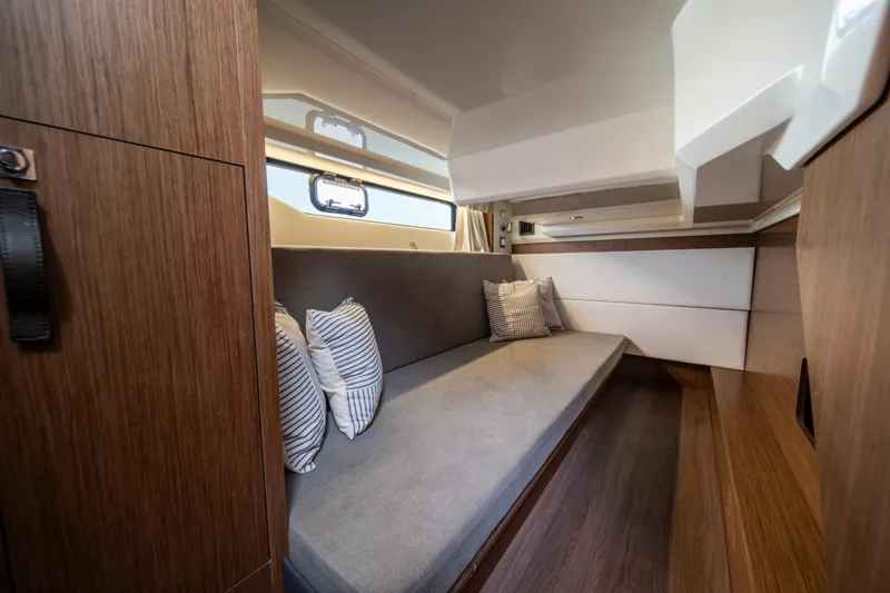  Yacht Photos Pics Luxurious interior cabin of 2026 Beneteau Antares 12 yacht with modern design.