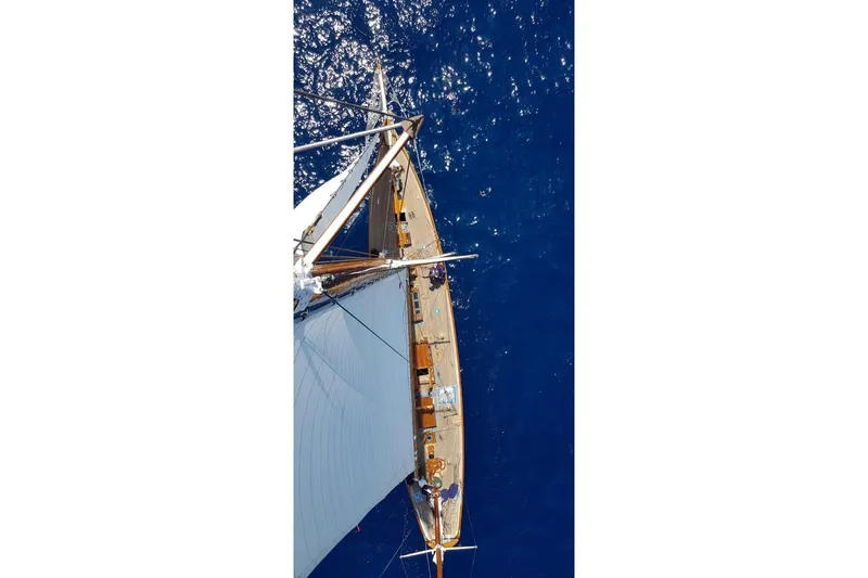  Yacht Photos Pics Aerial view of 1912 Fred Shepherd 70 ft Bermudan yawl sailing on deep blue sea.