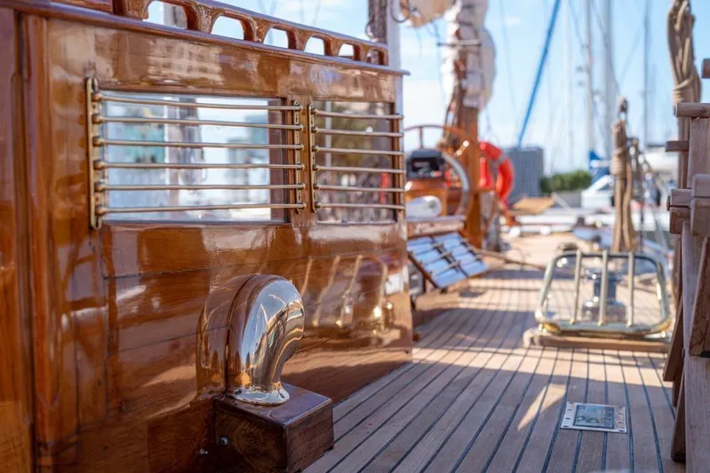  Yacht Photos Pics Polished wooden deck of 1912 Fred Shepherd 70 ft Bermudan yawl, showcasing classic nautical craftsmanship.