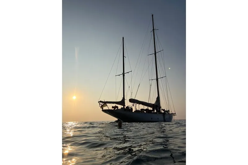  Yacht Photos Pics Historic 1912 Fred Shepherd 70 ft Bermudan yawl sailing at sunset.