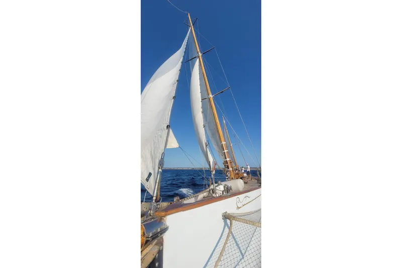  Yacht Photos Pics Historic 1912 Fred Shepherd 70 ft Bermudan yawl sailing on open sea, clear blue sky.