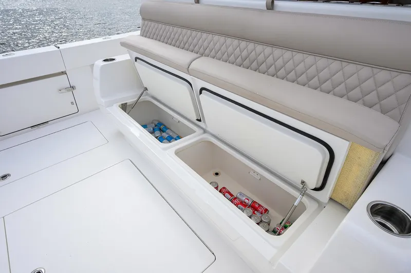 22 Yacht Photos Pics Valhalla Boatworks V-46 Center Console 2022 with open storage compartments and cushioned seating.