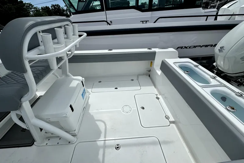  Yacht Photos Pics 2024 Bluewater 25t boat interior with seating and storage compartments.