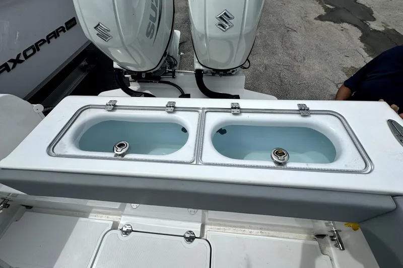  Yacht Photos Pics 2024 Bluewater 25t boat with dual Suzuki engines and live bait wells.