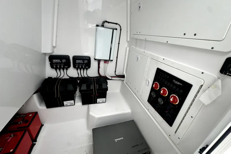  Yacht Photos Pics 2024 Bluewater 25t electrical system with NOCO Genius chargers and control panel.