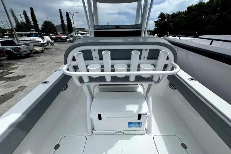  Yacht Photos Pics 2024 Bluewater 25t boat interior with rod holders and cooler on deck.