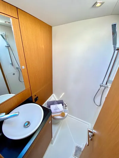Euphoria Yacht Photos Pics Modern bathroom in 2021 Jeanneau 60 yacht with sleek sink and shower.