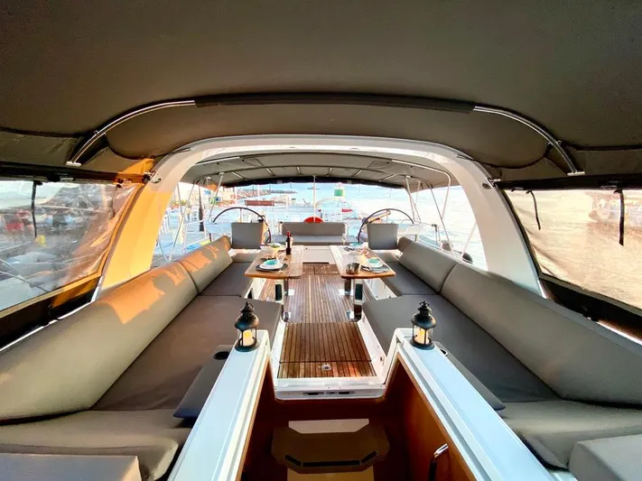 Euphoria Yacht Photos Pics Luxurious Jeanneau 60 yacht interior, 2021 model, featuring elegant seating and dining area.