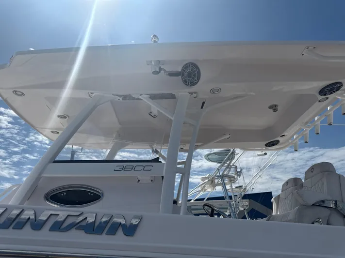  Yacht Photos Pics 2018 Fountain 38cc boat under clear sky, showcasing sleek design and structure.