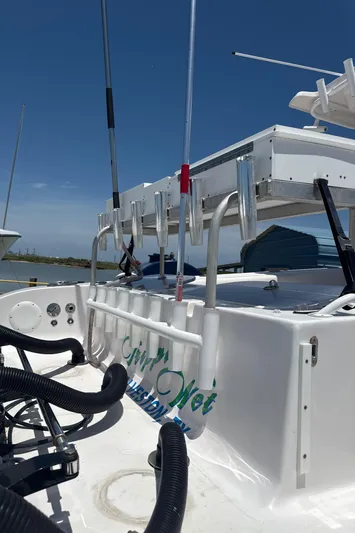  Yacht Photos Pics 2018 Fountain 38cc boat with fishing rod holders and equipment on deck.