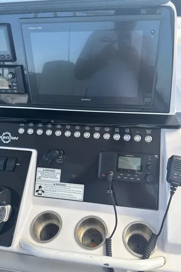  Yacht Photos Pics Control panel of a 2018 Fountain 38cc boat with electronic displays and controls.