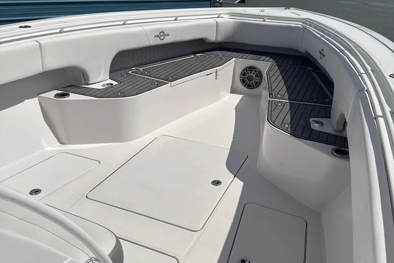  Yacht Photos Pics 2018 Fountain 38cc boat interior with sleek white seating and modern design.