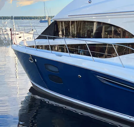 Saoirse Yacht Photos Pics 2011 Meridian 441 Sedan yacht docked on calm water, showcasing sleek design.