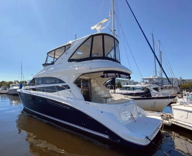 Saoirse Yacht Photos Pics 2011 Meridian 441 Sedan yacht docked at marina under clear blue sky.